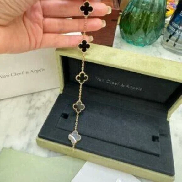 Van Cleef & Arpels 18K gold onyx 5-flower bracelet